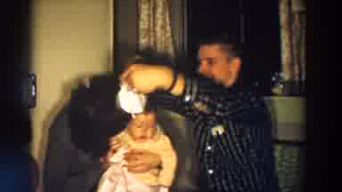 Aliquippa Pennsylvania (1958): Man Wearing Black Shirt Places Bib On Woman Wearing