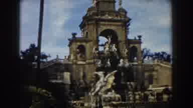 BARCELONA SPAIN-1959: Person Moves In Front Of Image Of Antique Building Next To