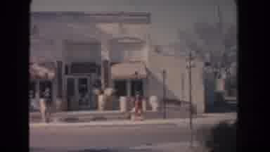 New Mexico (1951): Three Blue Cars Parked In Front Of White Building On A Bright