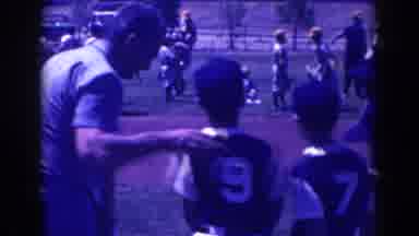 North Hollywood California-1961: Youth Baseball Team Gather On Field With Coach