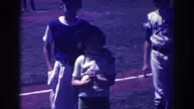 North Hollywood California (1961): Boy Wearing Baseball Uniform Hits Ball And Runs