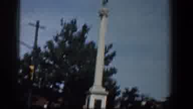 Washington DC (1961): A Column And A Statue In The Roads Of A Town Seen From A Car