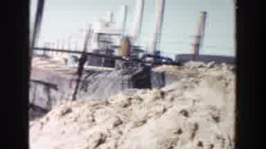 Grand Rapids Michigan (1956): A Dirt Pile Panning Over Past A Gate Where You Can