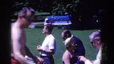 French Lick Indiana (1958): Two Men Light Cigarettes At Outdoor Gathering On A