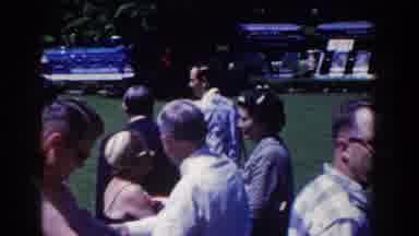 French Lick Indiana (1958): People Walking On Grass While Greeting And Smiling