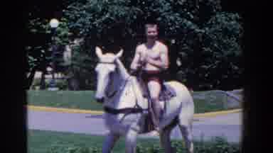 French Lick Indiana (1958): A Man On The Horseback Waving His Hand