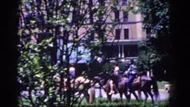 French Lick Indiana (1958): Brown Horses Walk By Brown Building On A Bright Sunny