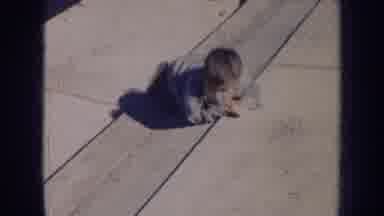 Nebraska (1956): Kid Boy Playing Outside Sidewalk And He Is Happy Enjoying The Sun