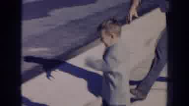 Nebraska (1956): Little Boy Attempts To Run Into Street When Cigarette Smoking Dad