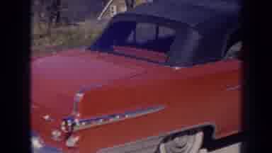 Nebraska (1956): View Of Redbrick And White Car Parked Behind White Car On A Sunny
