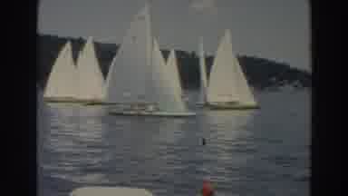 Wisconsin-1966: Sailboats Lined Up In The Water Next To The Shore