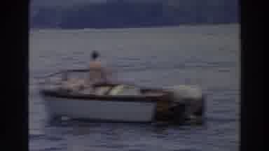 Wisconsin (1966): White Motorboat And Sailboats Sailing In Blue Lake Water On A