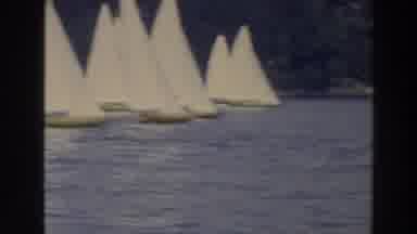 Wisconsin (1966): Right To Left Pan Of Many Sailboats In Light Wind In Water Near