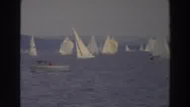 Wisconsin (1966): Small Motorboat Sailing Through Several Sail Boats Near The