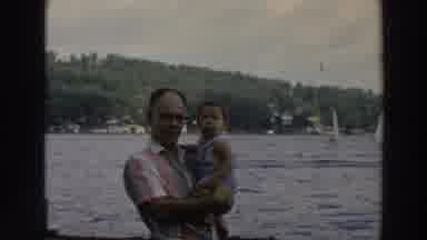Wisconsin (1966): Father And Child Surrounded By A Body Of Water