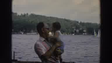 Wisconsin (1966): An Old Man Convincing A Young Baby For Photo Or A Video With The