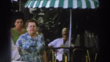 Wisconsin (1966): Two Women Walking Through Crowded Entertainment Venue