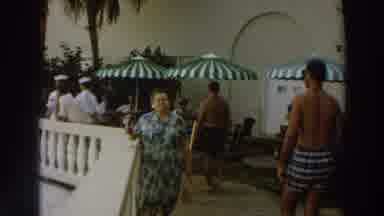 Wisconsin (1966): Old Lady Walking Toward Camera With People Passing On Opposite