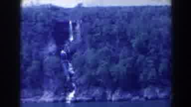 Niagra Falls Canada (1963): Film Of A Cliff Near Water With Beautiful Vegetation