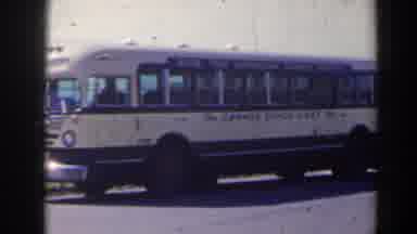 Niagra Falls Canada (1963): An Older Model Bus Parked On A Road
