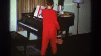 Clarendon Hills Illinois (1969): Boy Wearing Red Pajamas Searches Baby Grand Piano