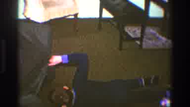 Clarendon Hills Illinois (1969): Woman Wearing Blue Dress Walks Past Brick Wall On