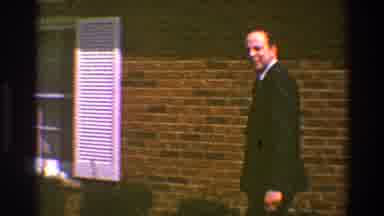 Clarendon Hills Illinois (1969): Man Walks Up Sidewalk Looks Back At The Camera