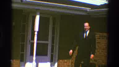 Clarendon Hills Illinois (1969): Man In Suit Waving At Camera Before Entering Home