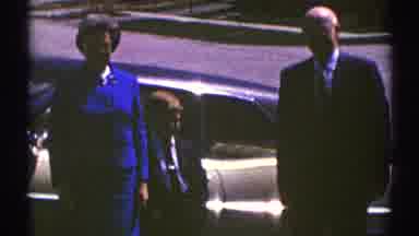 Clarendon Hills Illinois (1969): Woman Wearing Blue Dress Stands Next To Small Boy