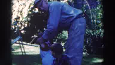 Tustin Wisconsin (1964): Father Helping Little Daughter To Walk In The Meadow