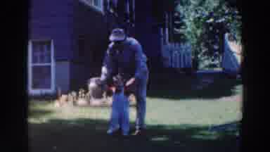 Tustin Wisconsin (1964): Father Walking Happy Child Back Yard Sunny Day Laughing