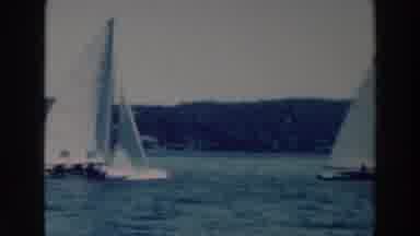 Tustin Wisconsin (1964): Dozens Of People Sailing Sail Boats In An Open Body Of