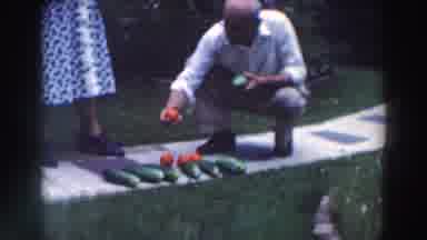 Tustin Wisconsin (1964): A Man On The Side Of The Road About To Eat A Fruit That