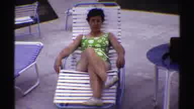 Nebraska (1969): Lady On Swimming Suit Laying On Lawn chair