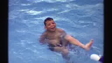 Nebraska (1969): A Young Boy Is Splashing And Playing In A Shallow Pool