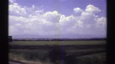 Nebraska (1969): Passing View Of Black And White Eco Sign On A Sunny Day