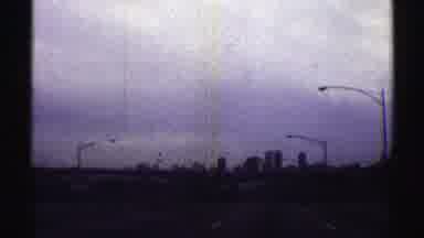 Nebraska (1969): Approaching View City Skyline And Street Lights On A Clear Day