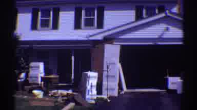 Clarendon Hills Illinois (1969): View Of A White House With Open Garage Door On A