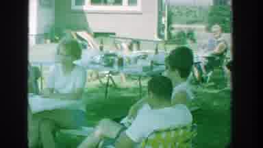 Michigan (1964): Adults Socialize At An Outdoor Party