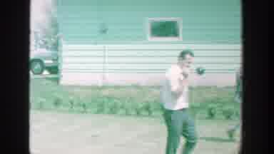Michigan (1964): People Walking Outside A Trailer On A Gravel Trail
