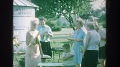 Michigan (1964): Group Of People Share In An Outdoor Meeting Apparently They Make