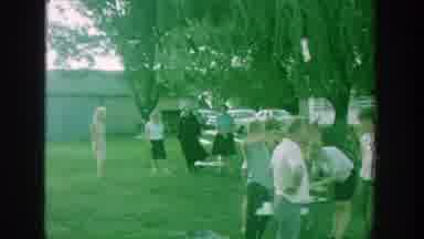Michigan (1964): A Big Group Of People Standing Around At An Outdoor Gathering