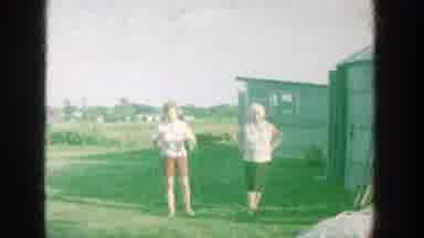 Michigan (1964): People Sitting In Lawn Chairs Eating Corn On The Cob On A Sunny