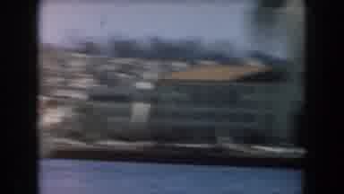 California (1961): The Camera Pans Across The Water And Captures The Buildings
