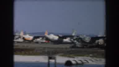 California (1961): Footage Of Rows Of Various Types Of Airplanes Along The Water