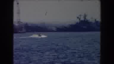 California (1961): View O Grey Cargo Ships Docked At Sea Port On A Sunny Day
