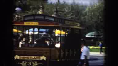 California (1961): View Of People Shopping In Open Marley And Trolley Car As It