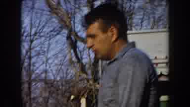California (1961): A Man And Two Girls Outside Looking At Something Located On The