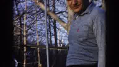California (1961): Man And Two Girls In Park Looking At Metal Fixtures Reaching
