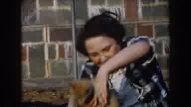 California (1961): Fat Kid Drops Cat Listening To Music On The Sidewalk